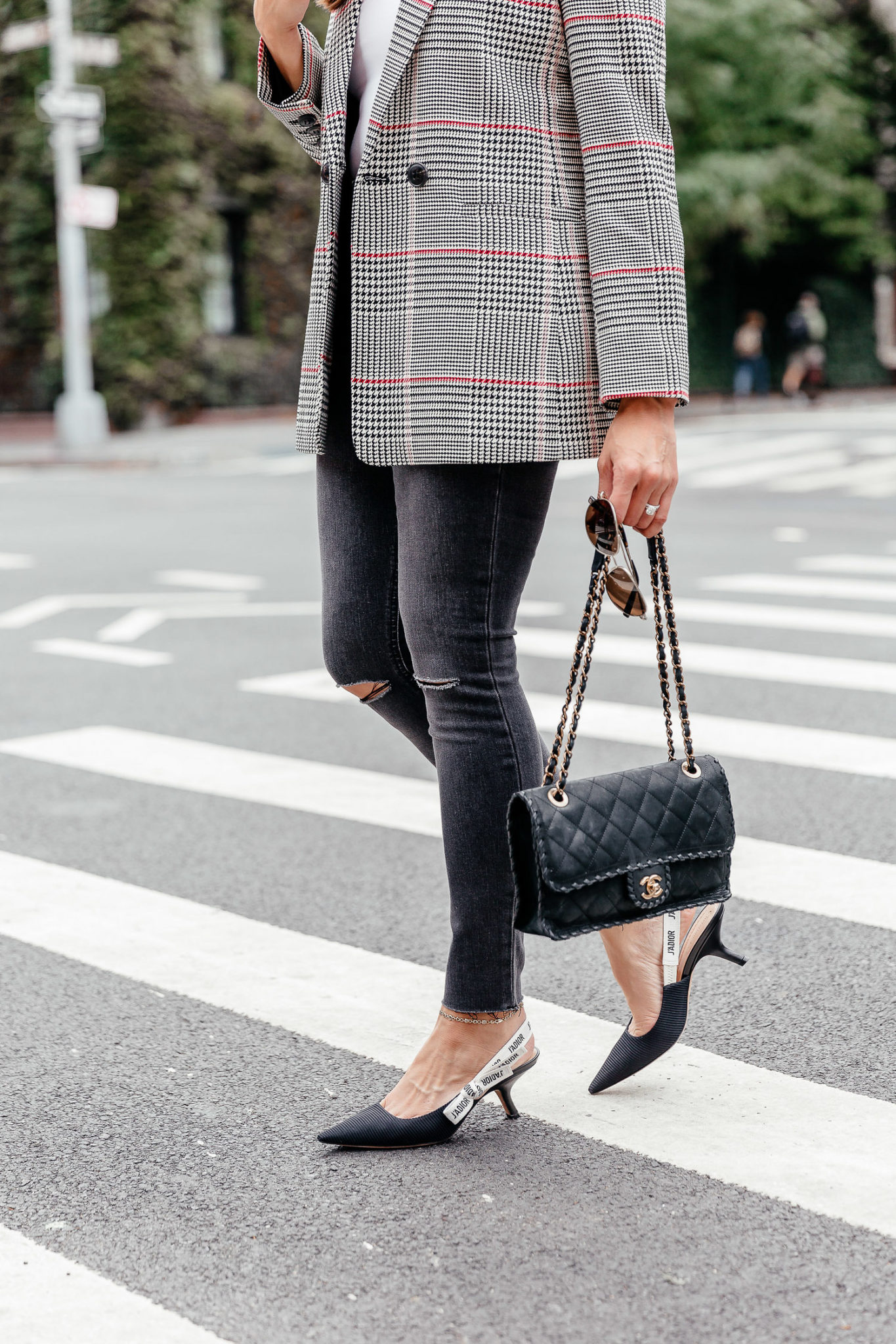 An easy Fall trend to adopt is the plaid blazer, seen here on South Florida fashion blogger Amanda of A Glam Lifestyle during NYFW with her Dior kitten heels and grey Wrangler denim