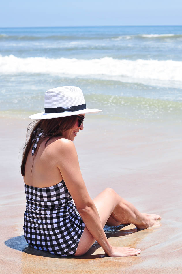 Gingham retro swimsuit one-piece on sand at Daytona beach