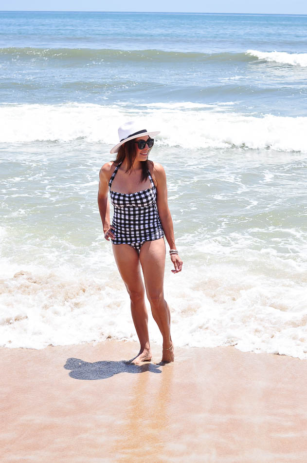 woman wearing LOFT Gingham one-piece swimsuit full look at Daytona beach