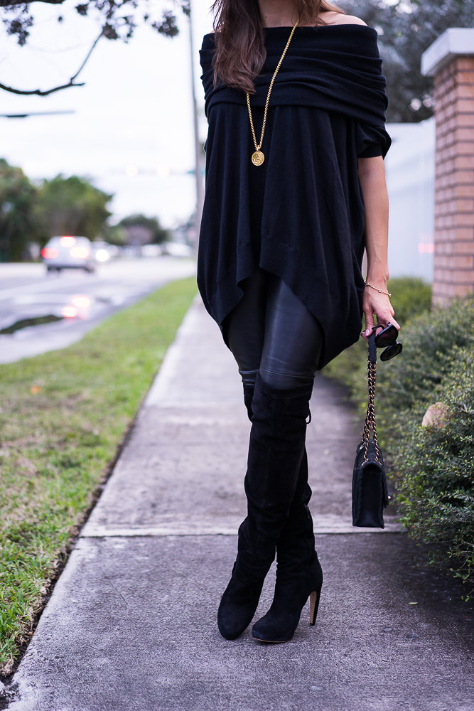 Black cashmere sweater and faux leather leggings close up