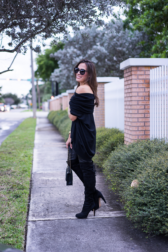 A Glam Lifestyle Blogger Amanda Champion wearing Black cashmere sweater, black leggings, and black boots