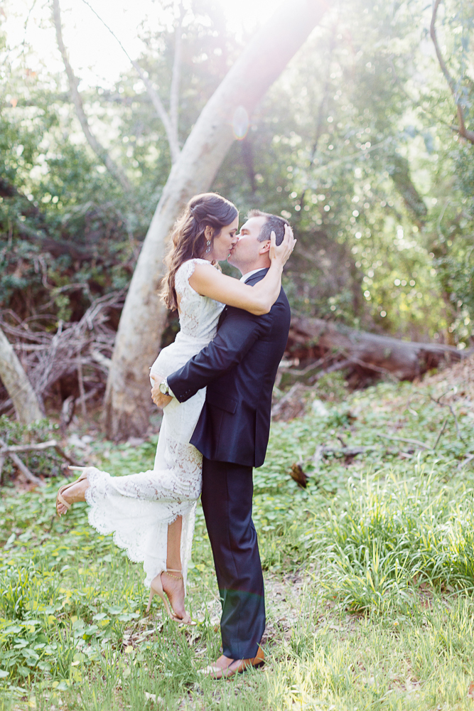 couples kissing in their Malibu Beach Engagement photos