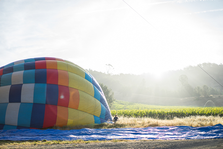 A Glam Lifestyle Blogger Amanda Champion shares Napa Hot Air Balloon Tour - in photo: inflating a hot air balloon