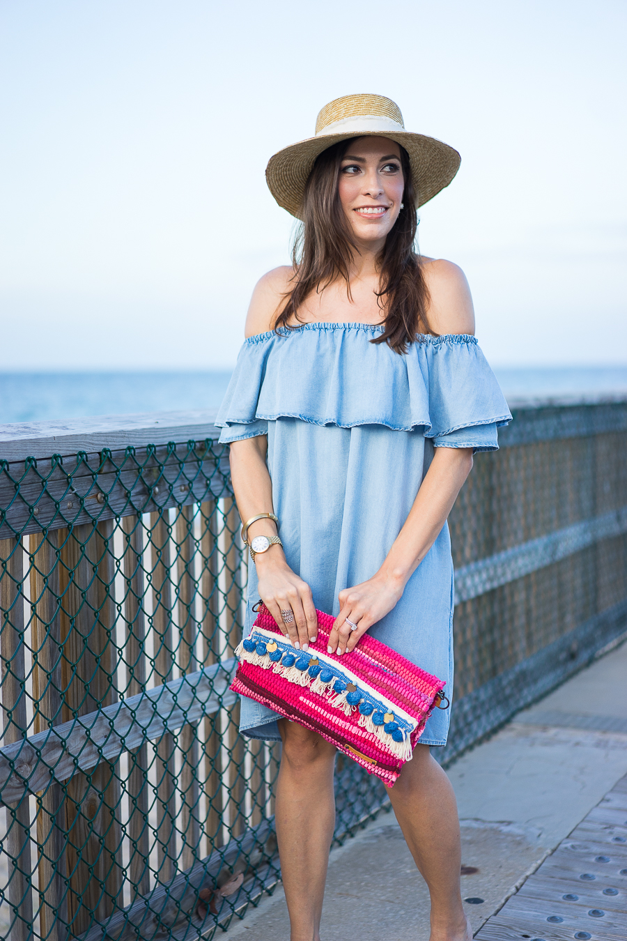 A Glam Lifestyle fashion blogger wearing Zara chambray denim dress with Rag and Bone Laurie straw boater hat and M Gemi sandals