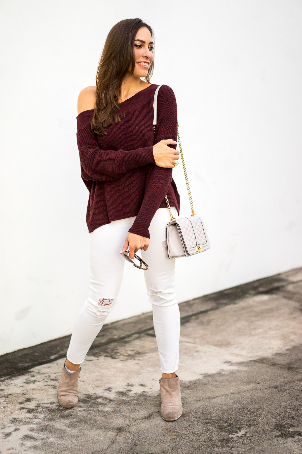 A Glam Lifestyle fashion blogger wearing Free People slouchy sweater with dolman sleeves and Sam Edelman petty boots for fall fashion style