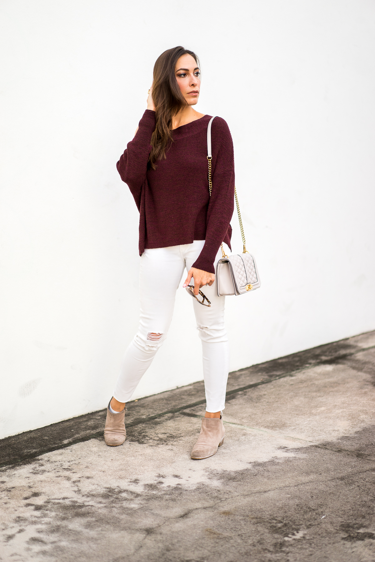 A Glam Lifestyle fashion blogger Amanda Mercado shows you how to wear falls trends including this burgundy off the shoulder sweater