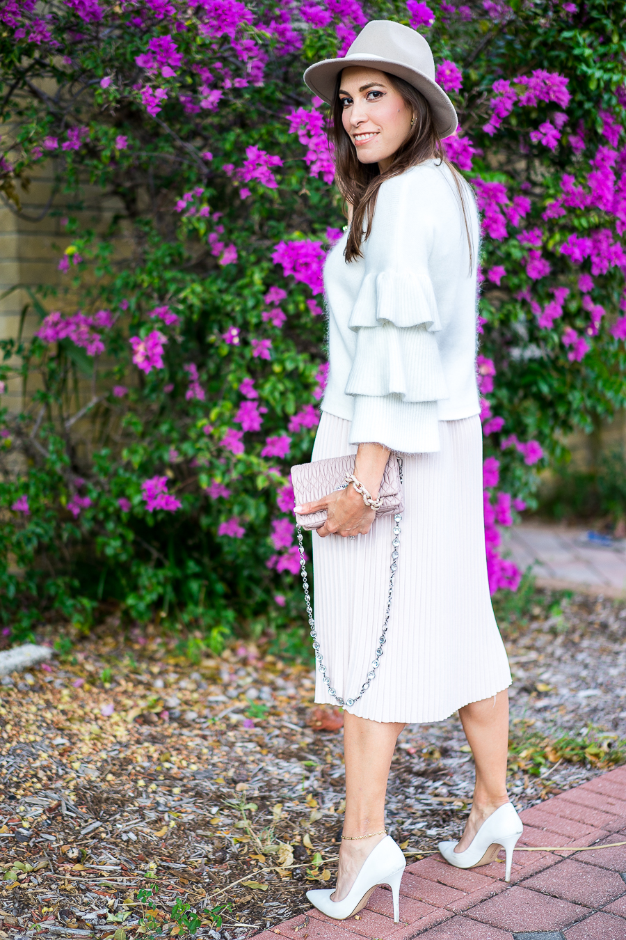 A Glam Lifestyle fashion blogger wearing Endless Rose tiered sleeve sweater and blush pleated midi skirt with Miu Miu bag and white pumps