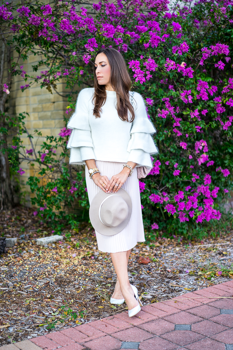 A Glam Lifestyle fashion blogger wearing Endless Rose tiered sleeve sweater and blush pleated midi skirt with Miu Miu bag and white pumps