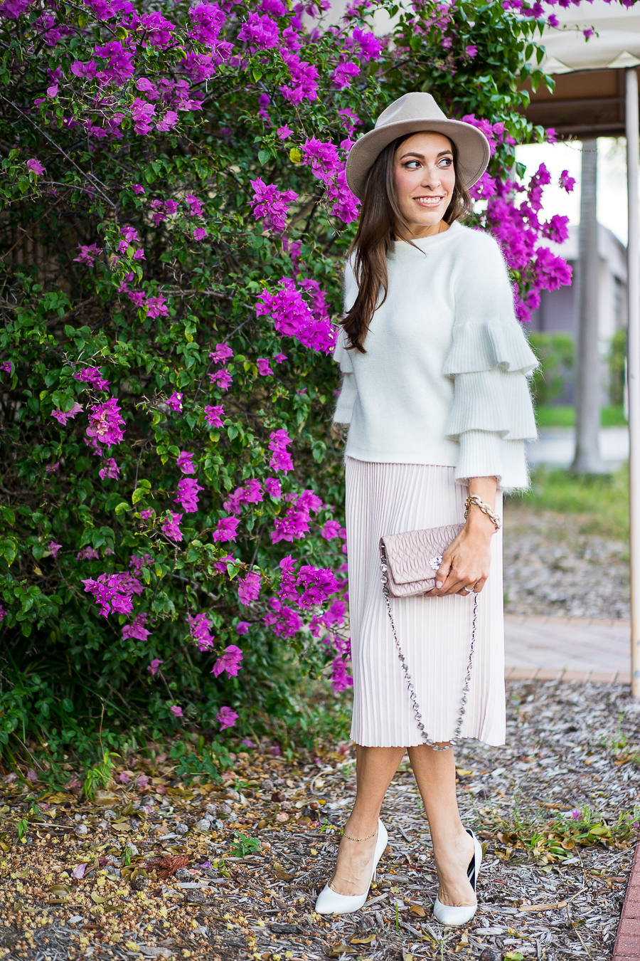 A Glam Lifestyle fashion blogger wearing Endless Rose tiered sleeve sweater and blush pleated midi skirt with Miu Miu bag and white pumps