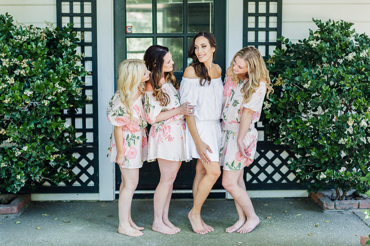 A Glam Lifestyle fashion blogger wedding at Beaulieu Garden Napa Valley wearing Plum Pretty Sugar off the shoulder dresses for bridesmaid outfits while getting ready