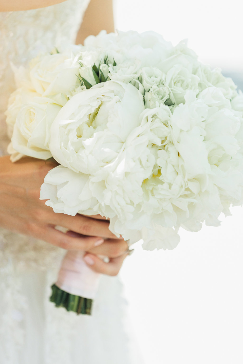 A Glam Lifestyle Blogger Amanda Champion shares here wedding decor details - in photo: bride holding her  bouqet by Rion Designs, wedding decor