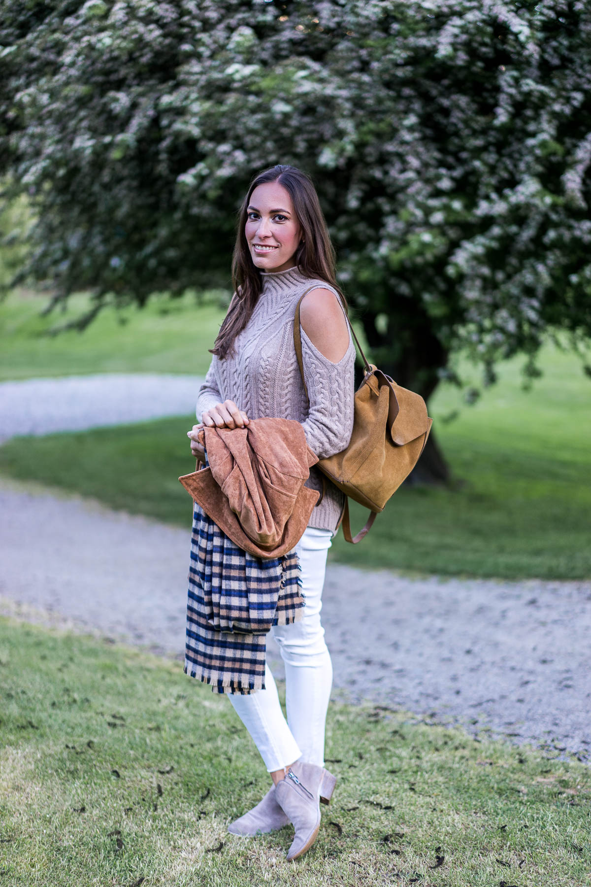 a glam lifestyle south florida fashion blogger styles a cashmere cold shoulder sweater with white ankle legging jeans and neutral ankle booties