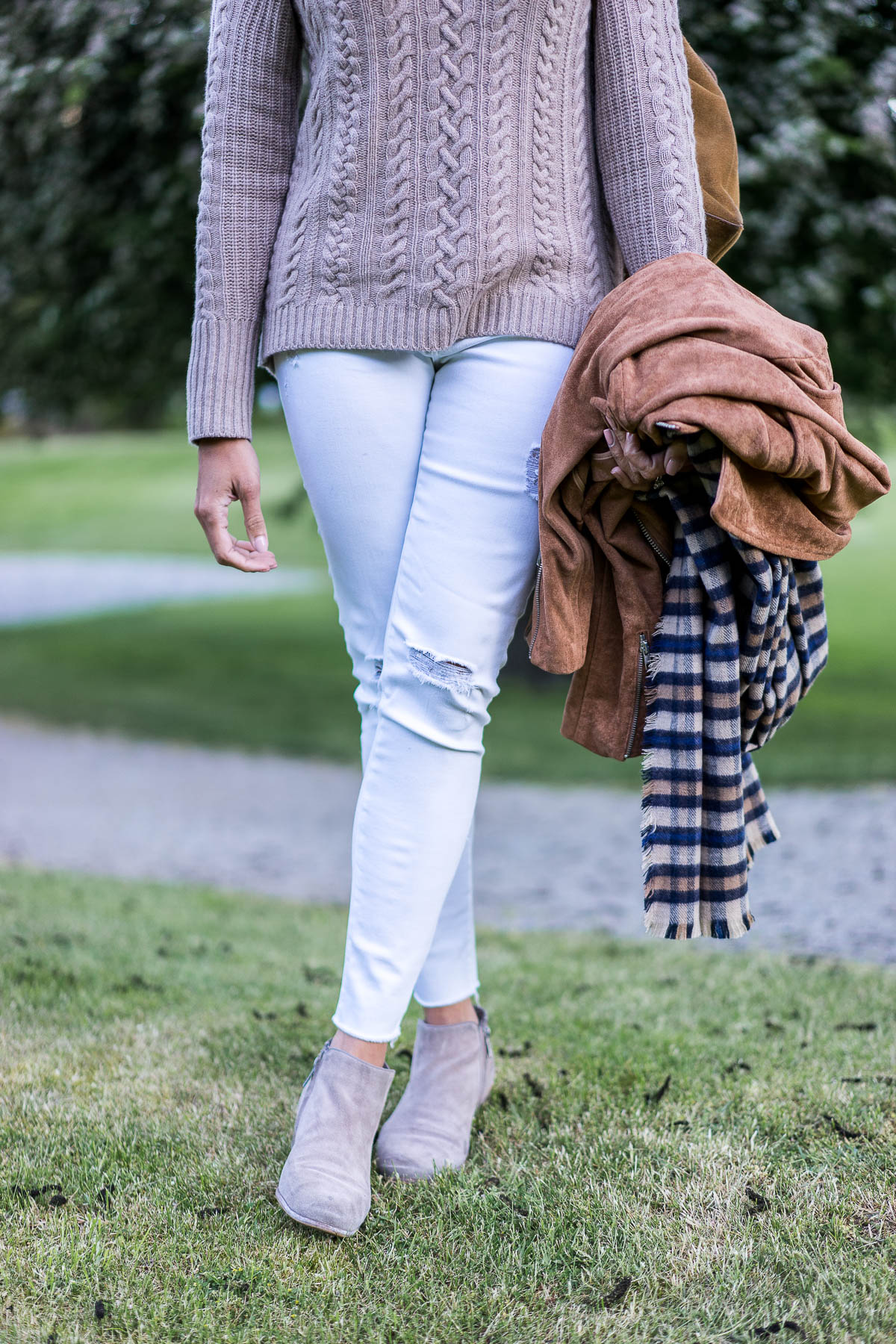 a glam lifestyle fashion blogger wearing white AG Jeans with cashmere cold shoulder sweater and sam edelman petty booties