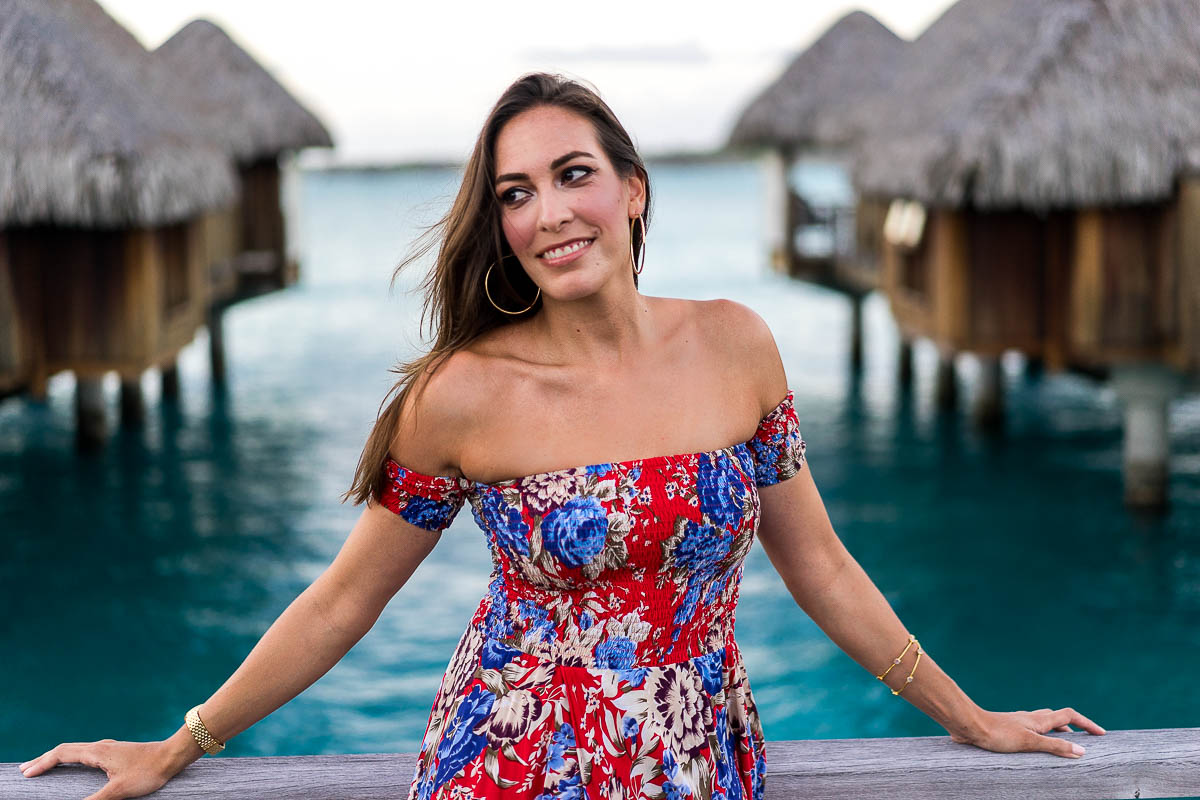 Blogger A Glam Lifestyle enjoys sunset in Bora Bora wearing floral maxi dress by Auguste the Label by overwater bungalows