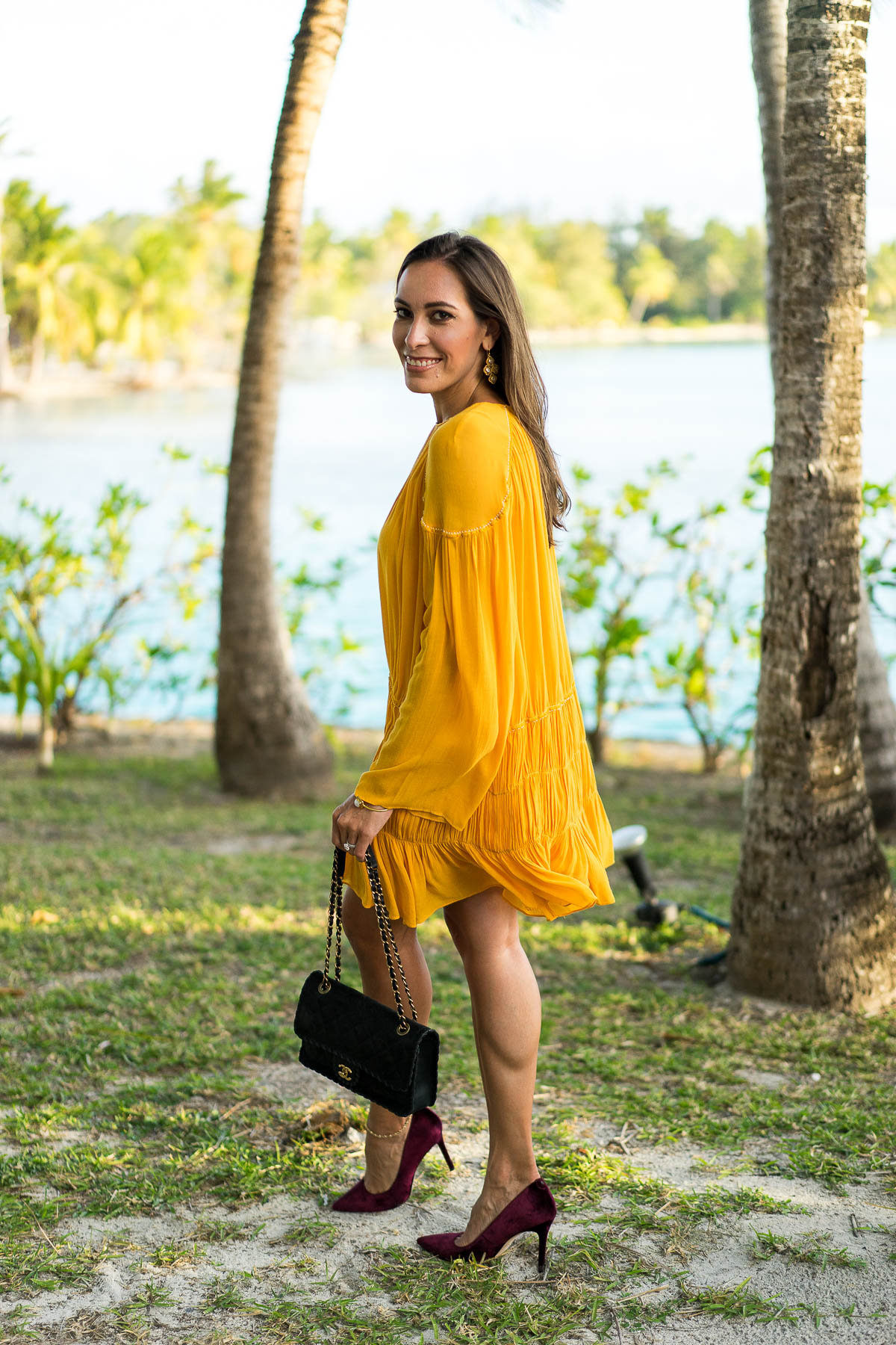 Learn how to style a mustard yellow dress by South Florida fashion blogger Amanda from A Glam Lifestyle