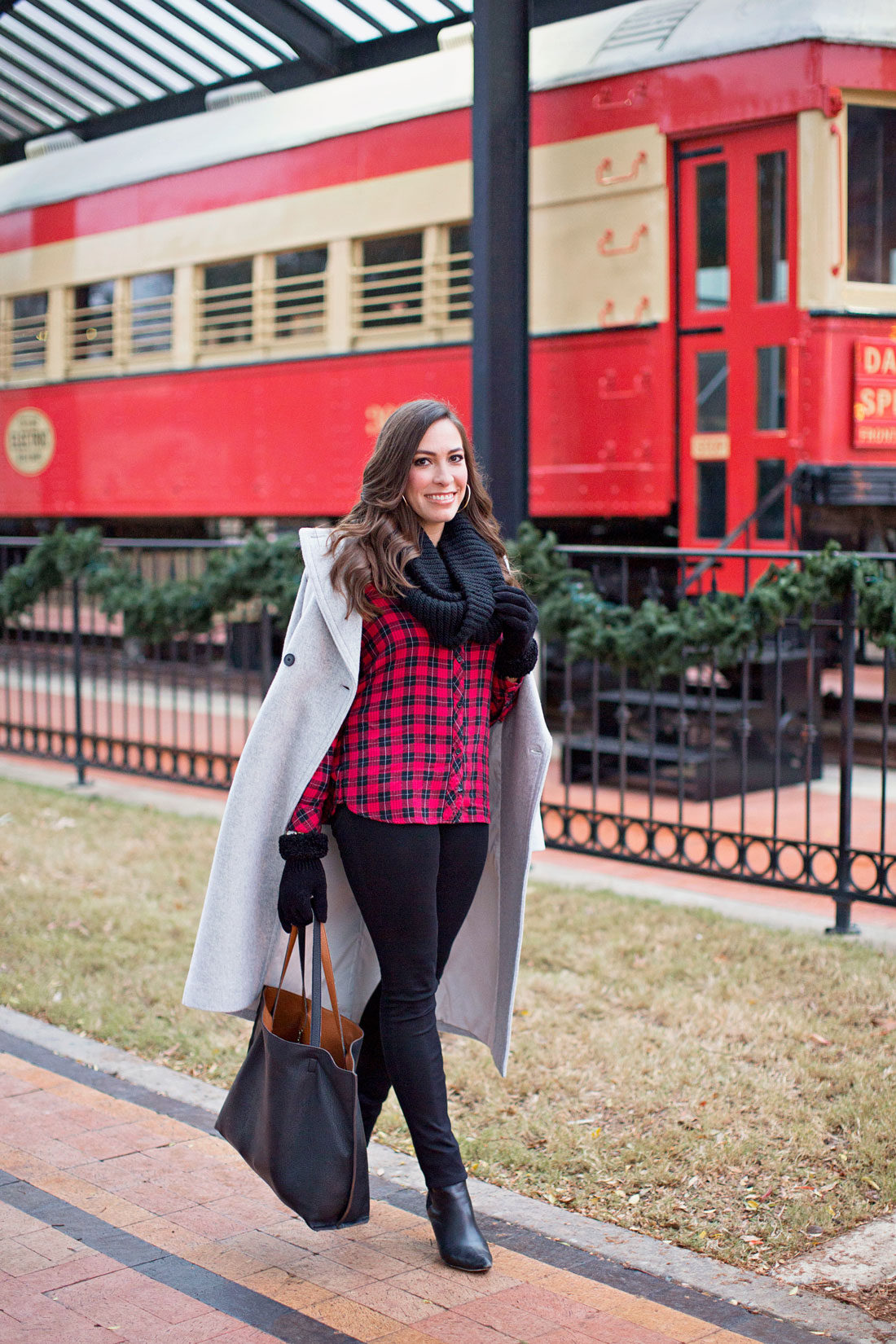 A Glam Lifestyle fashion blogger Amanda wears casual Christmas outfit in buffalo plaid shirt with Nordstrom reversible tote and black infinity scarf topped with Club Monaco Daylina coat