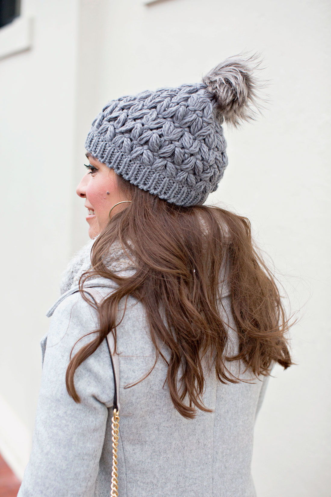Amanda from A Glam Lifestyle blog wears BP grey beanie from Nordstrom with her travel outfits
