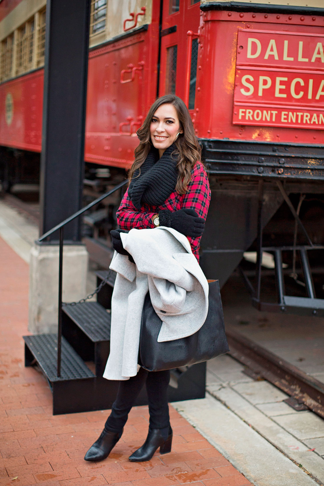 A Glam Lifestyle fashion blogger wears a red and black buffalo plaid shirt with AG Jeans black leggings and club monaco daylina grey coat with aska collection troy booties carrying Nordstrom reversible tote