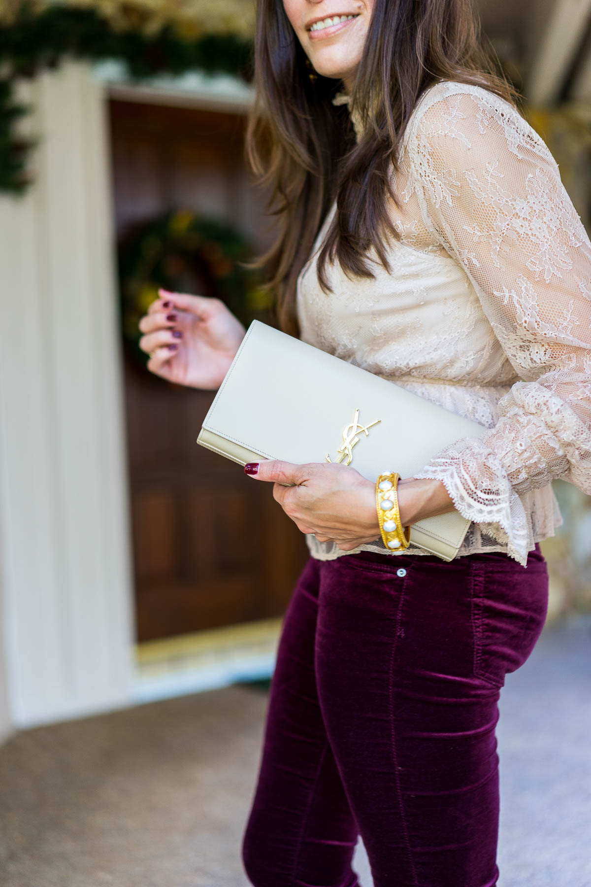 A Glam Lifestyle blogger Amanda carries her YSL nude monogram clutch with her Christmas day outfit