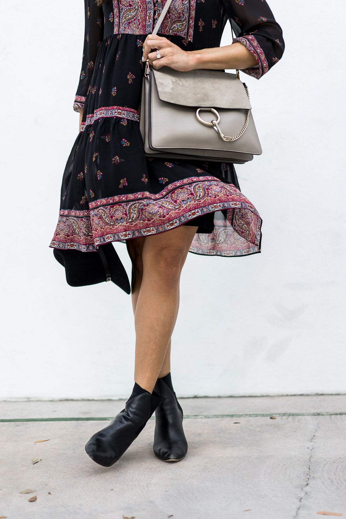 A Glam Lifestyle blogger shares her boho style in Joie Alpina dress carrying Chloe Faye bag and completing the look in ASKA Troy booties