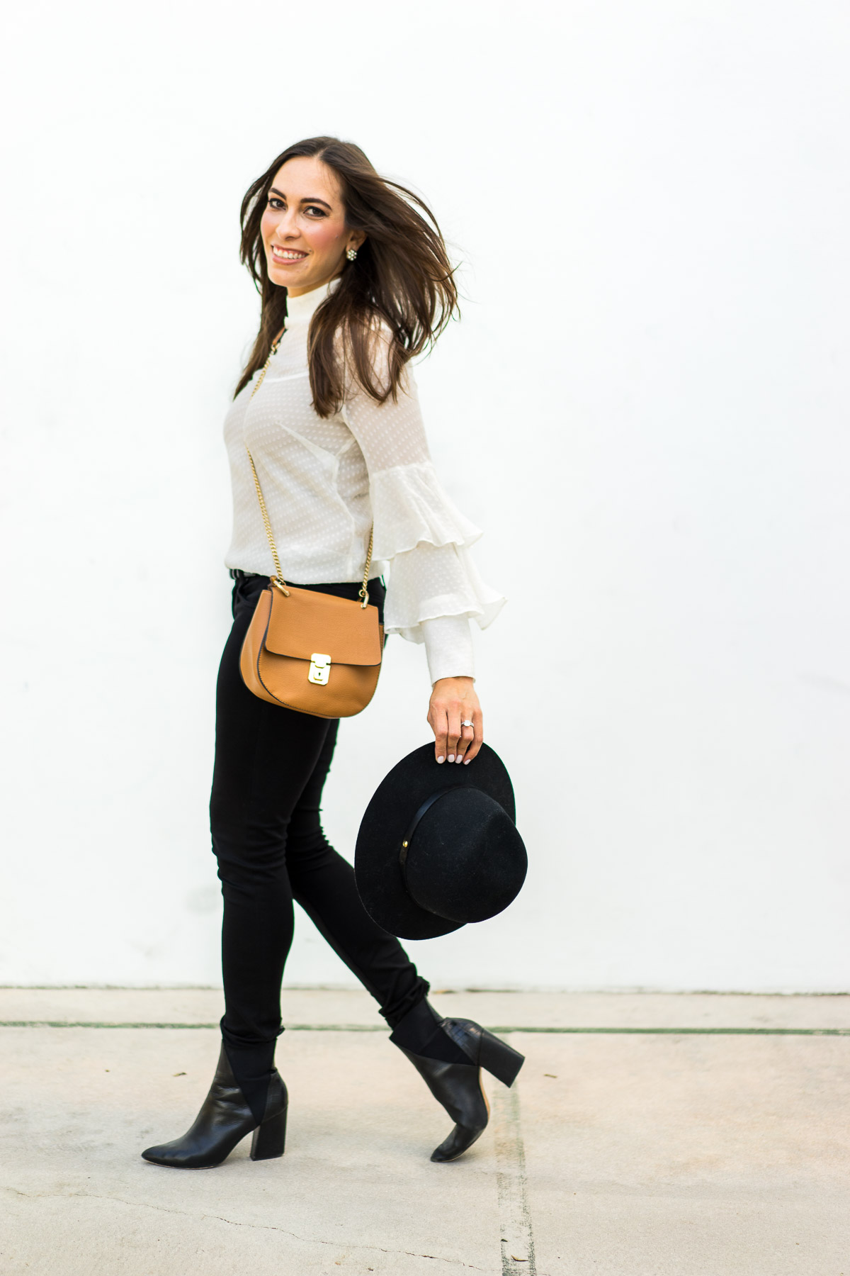 A Glam Lifestyle South Florida blogger wears sheer white blouse with black AG Jeans leggins and Chloe Drew dupe bag