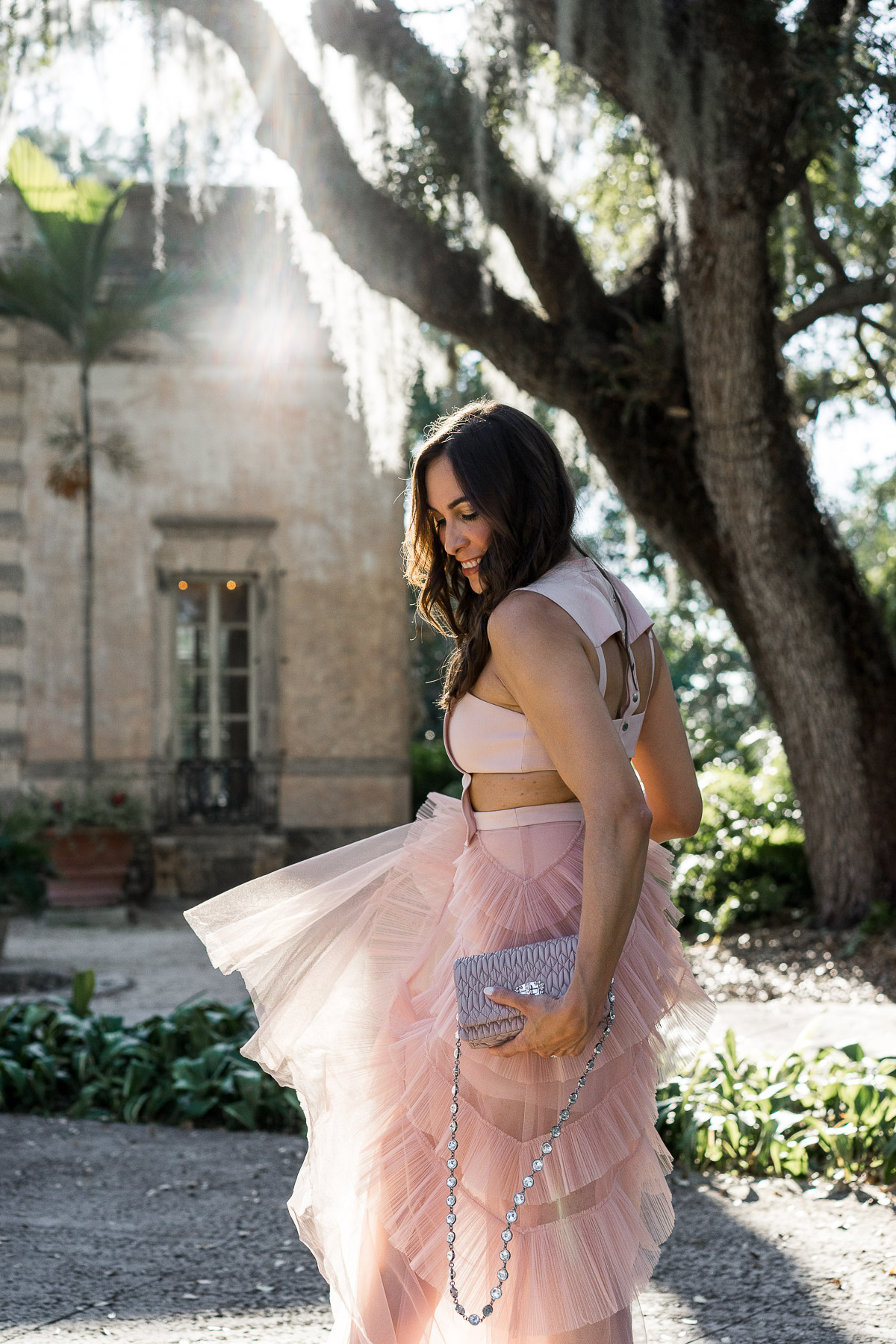 Fashion blogger Amanda from A Glam Lifestyle blog wears gorgeous BCBG Avalon blush tulle dress with Miu Miu bag and Christian Louboutin Pigalle pumps