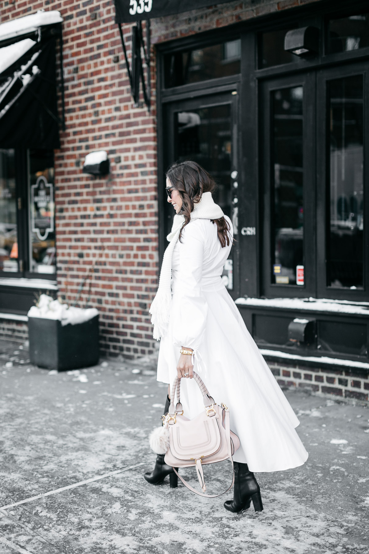 Amanda from A Glam Lifestyle blog wears Carolina Constas Lena white shirt dress in Greenwich Village during NYFW Spring 2017 while carrying Chloe Marcie bag for her NYFW street style