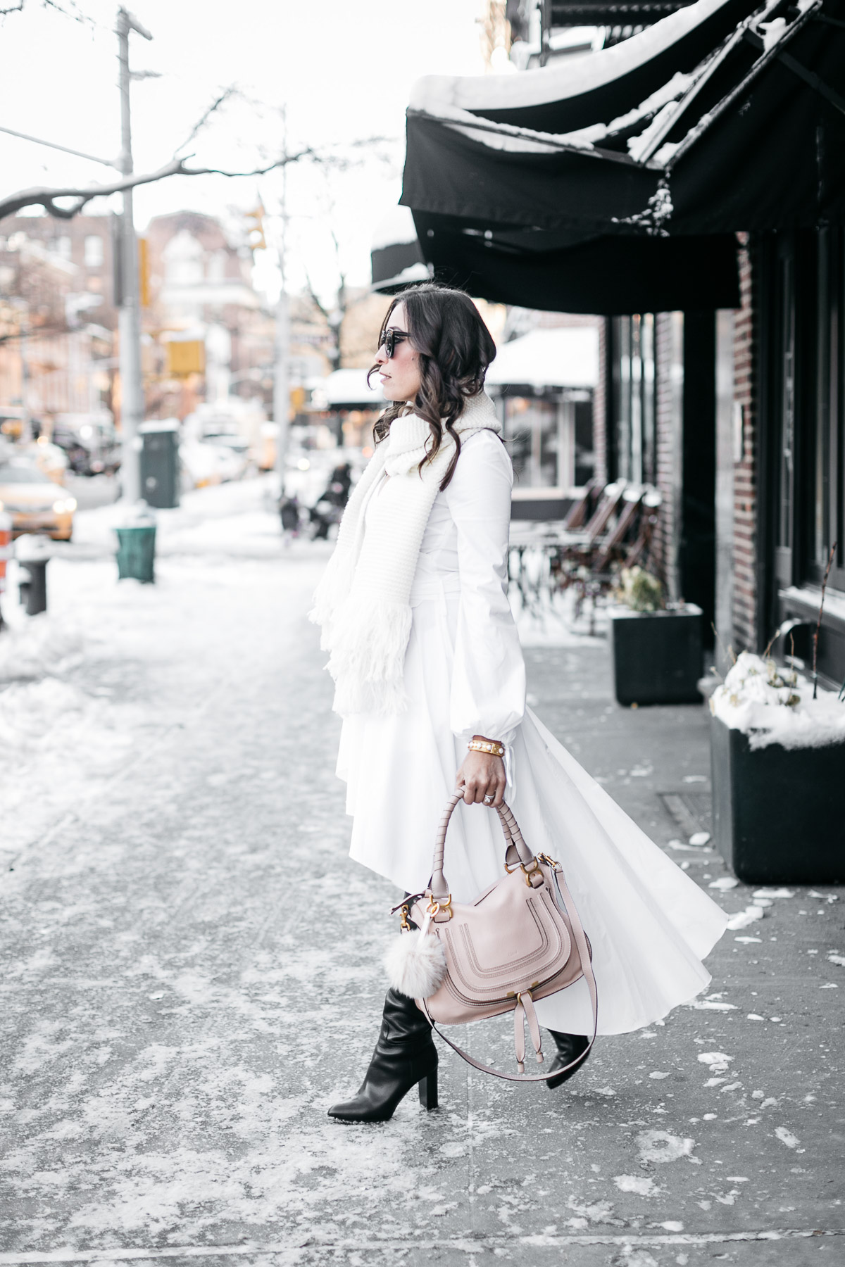 NYFW street style by Amanda of A Glam Lifestyle wearing Carolina Constas white shirt dress and Chloe Marcie bag with MGemi Pendolo boots