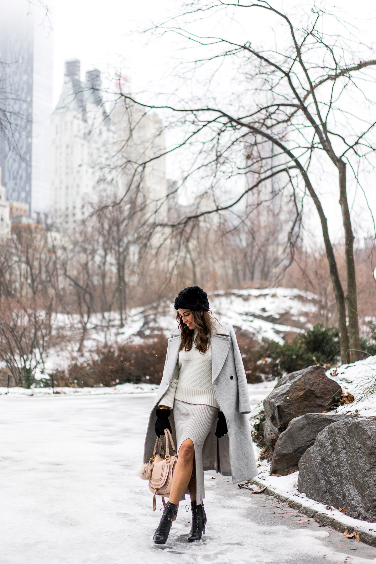 BCBGeneration skirt paired with Club Monaco Daylina coat and white knit sweater with blush nude Chloe Marcie bag by A Glam Lifestyle blogger Amanda during NYFW in Central Park