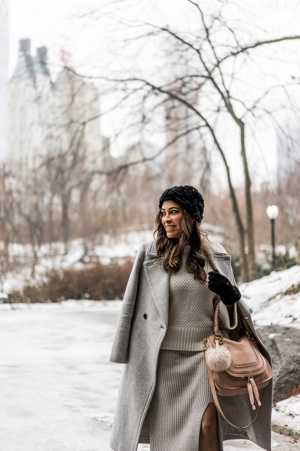 South Florida fashion blogger Amanda visits Central Park during NYFW wearing her grey midi skirt and grey Club Monaco coat with military inspired booties