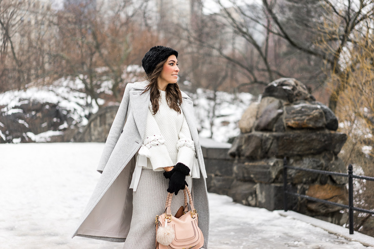 NYFW street style with a neutral look featuring BCBGeneration grey midi skirt and Club Monaco coat and sweater details by South Florida fashion blogger Amanda from A Glam Lifestyle