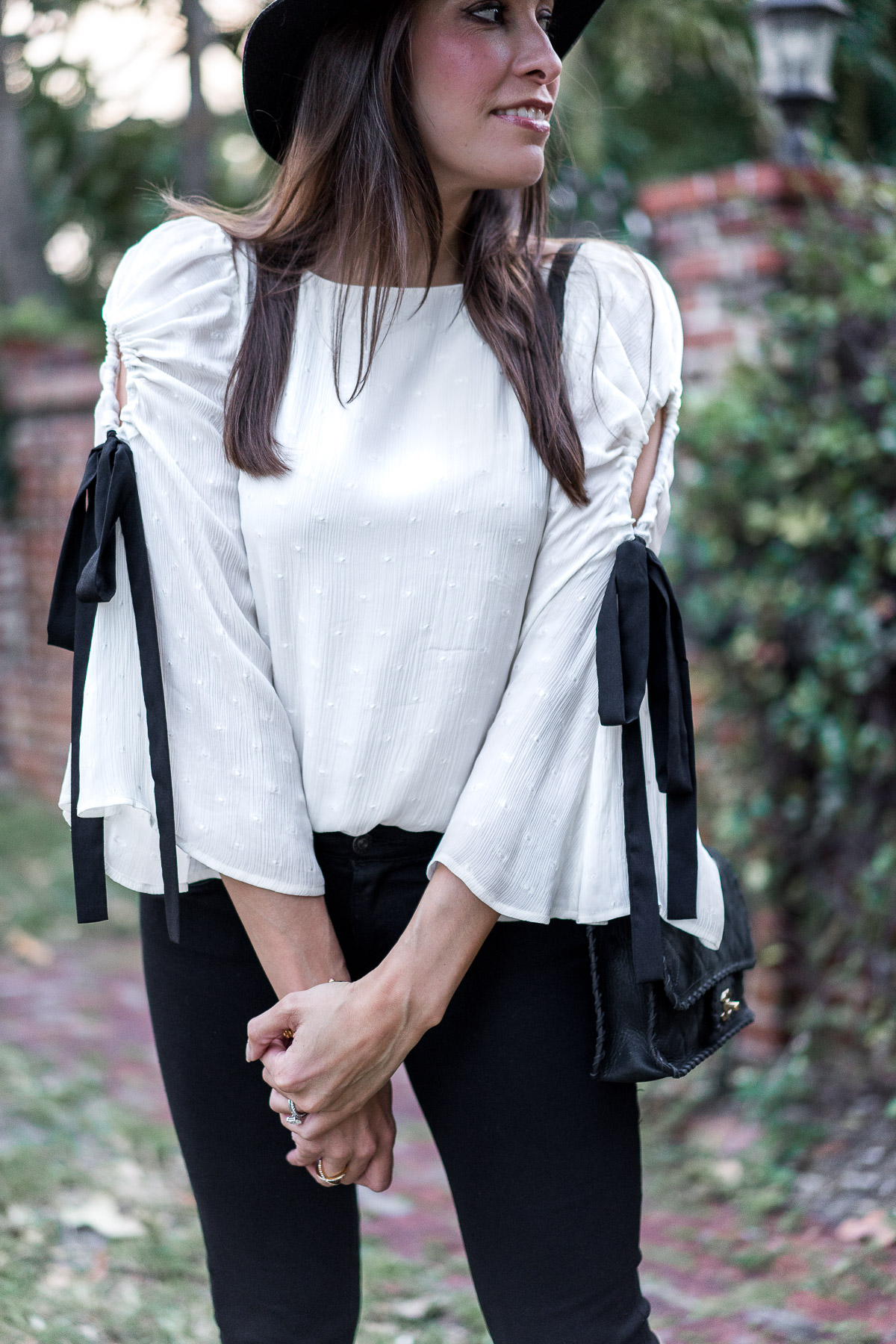 Fluttery bell sleeve top from Club Monaco with black tie details styled by Amanda of A Glam Lifestyle blog