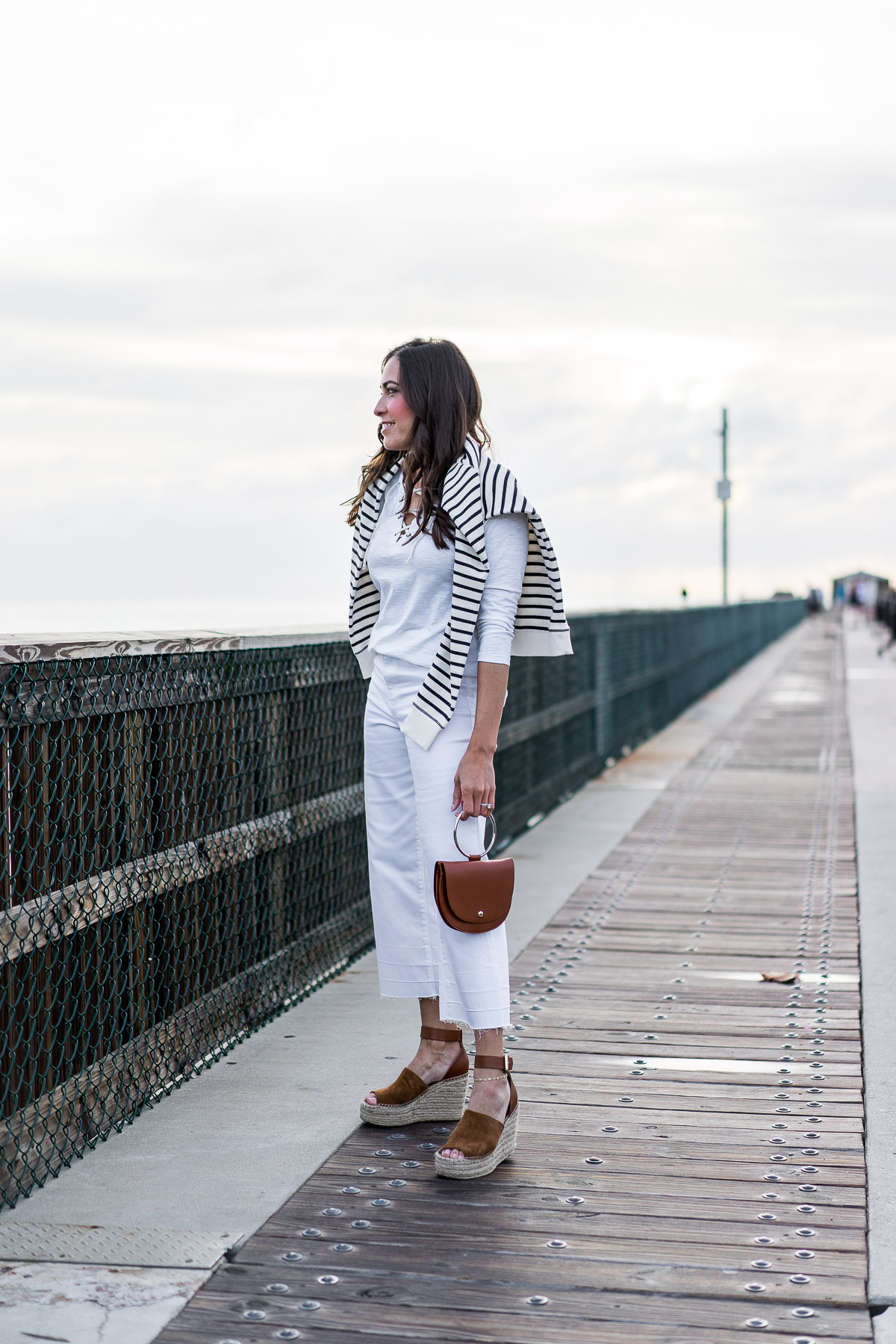 Old Navy lace up tee and Old Navy high waist white ankle jeans are styled by South Florida blogger Amanda of A Glam Lifestyle with Old Navy striped sweatshirt