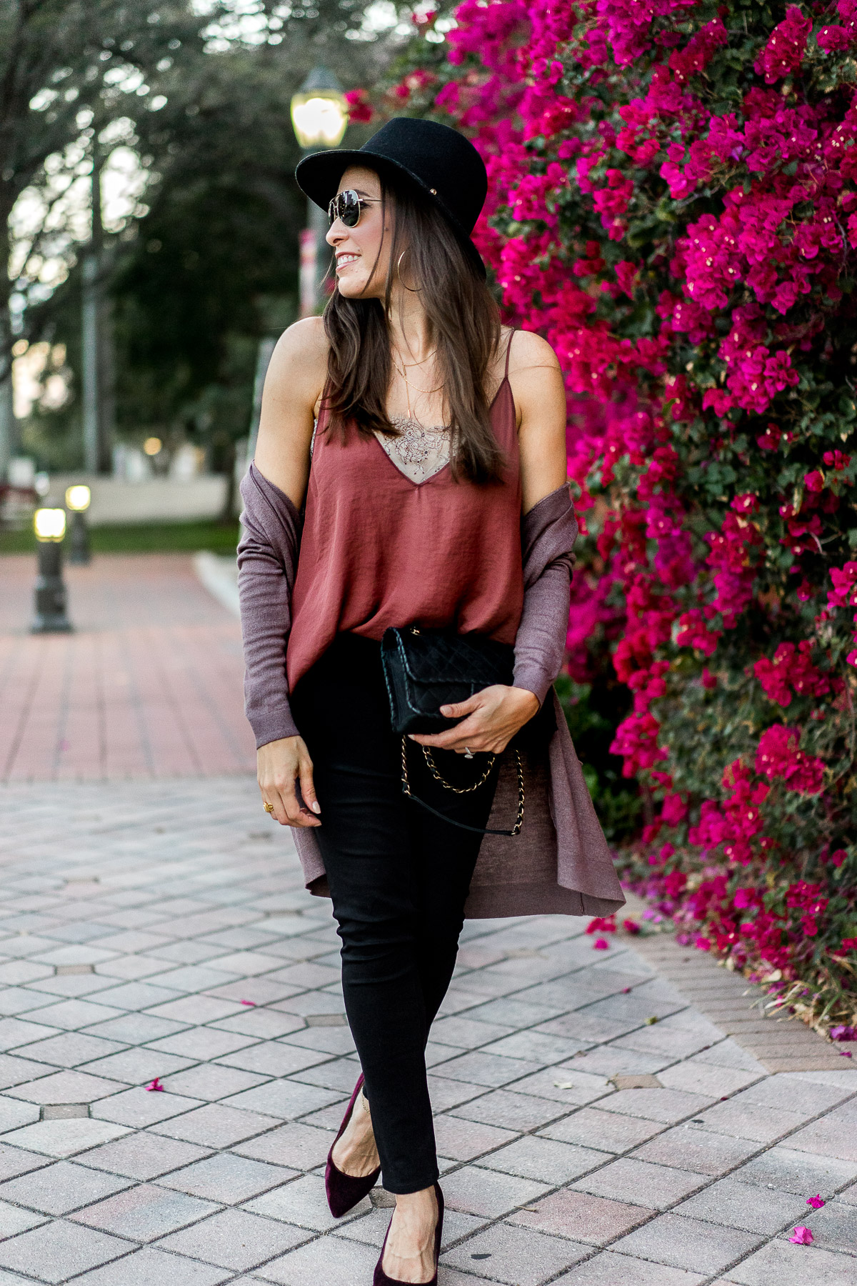 Blogger Amanda from AGlamLifestyle wears Free People Deep V bandeau cami with lace