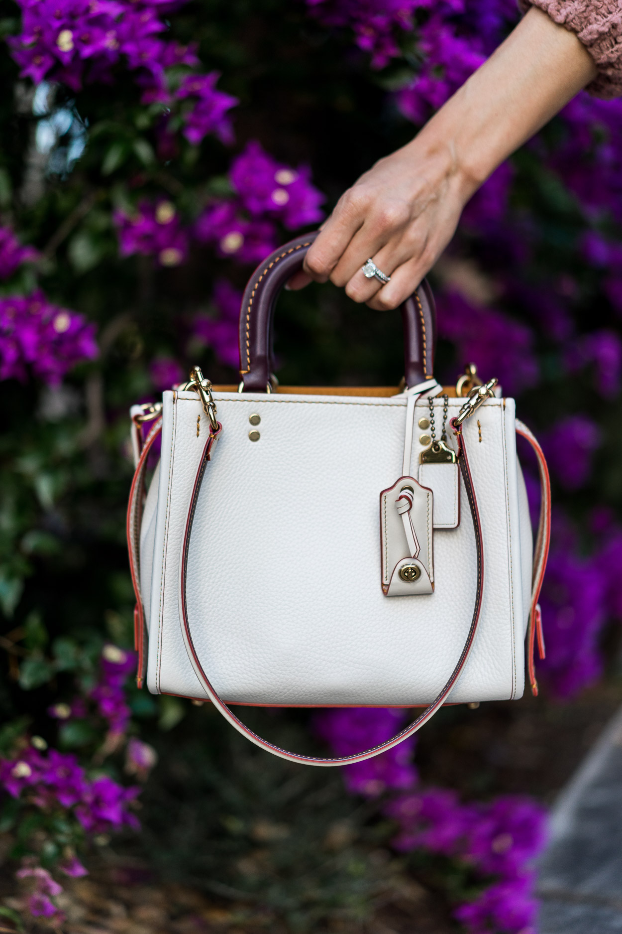 Chic white Coach Rogue bag is styled by Amanda of A Glam Lifestyle blog with Free People oversized cardigan and Cami NYC velvet top