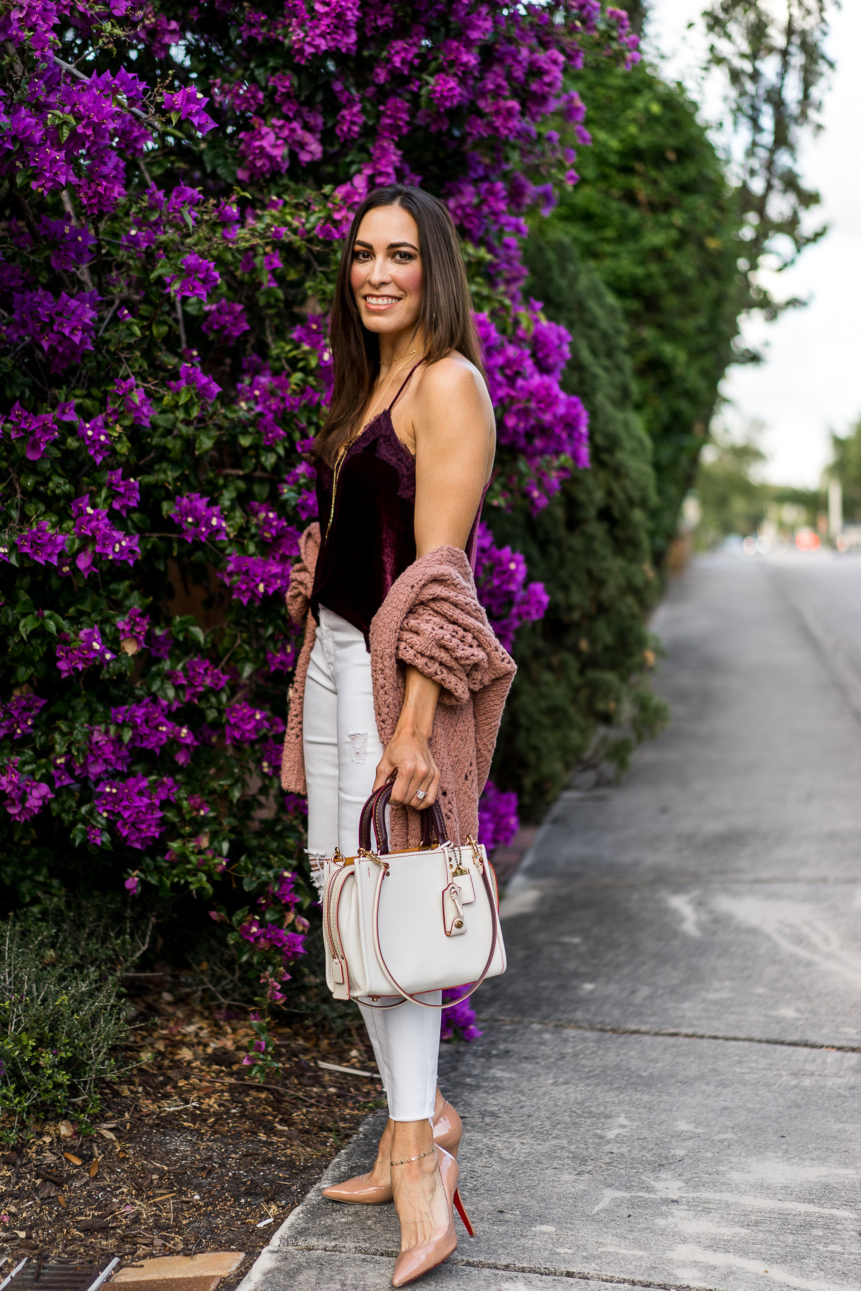 Coach Rogue bag worn by fashion blogger Amanda of A Glam LIfestyle with blush Free People cardigan and velvet cami top