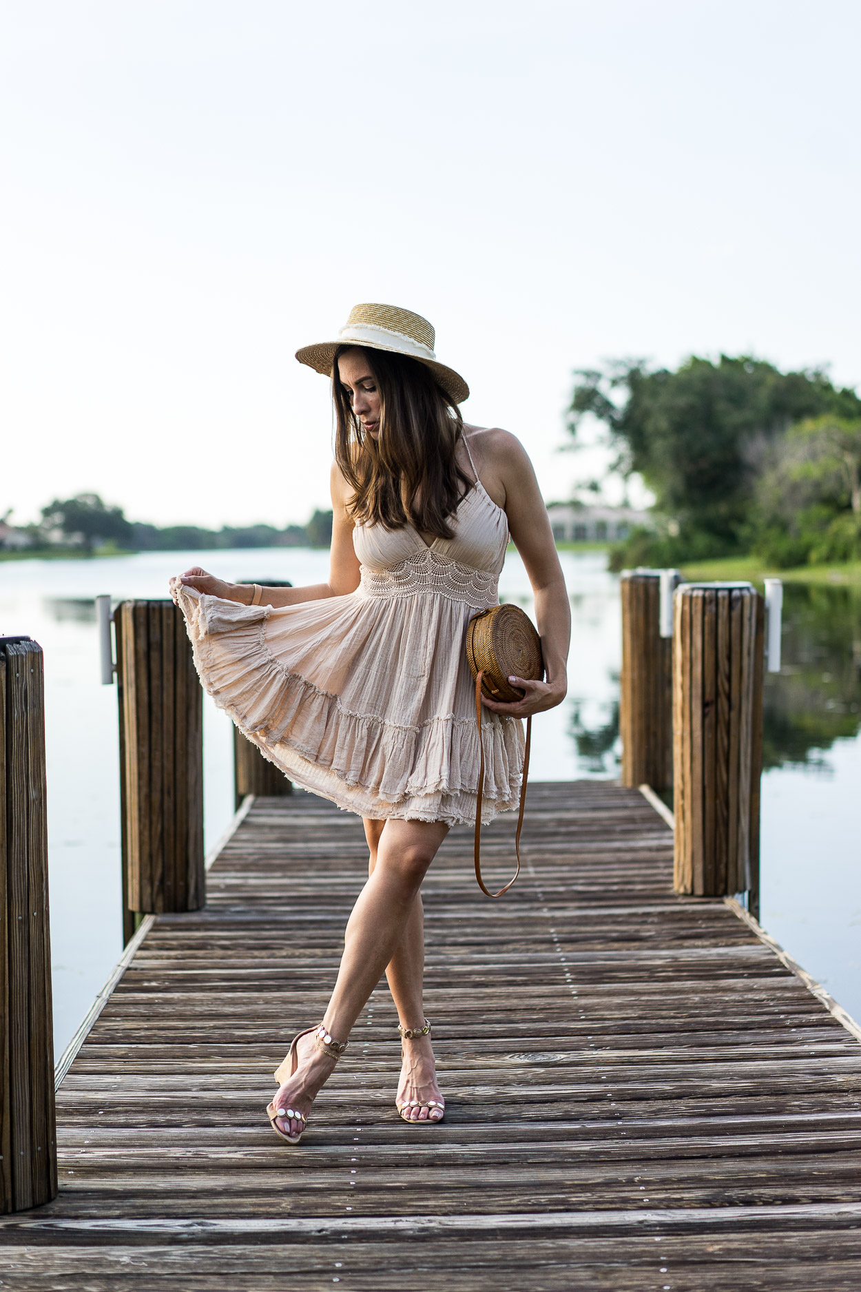 Boho inspired mini dress worn by Amanda of AGlamLifestyle blog is the Free People 200 Degrees mini dress which is perfect for Summer with a round basket bag