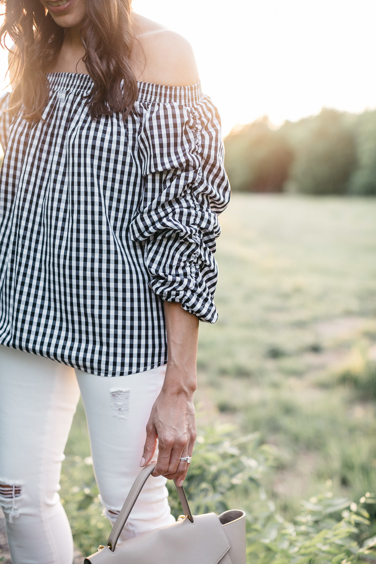 Gingham top is worn off the shoulder by Amanda of AGlamLIfestyle blog to show her Spring style