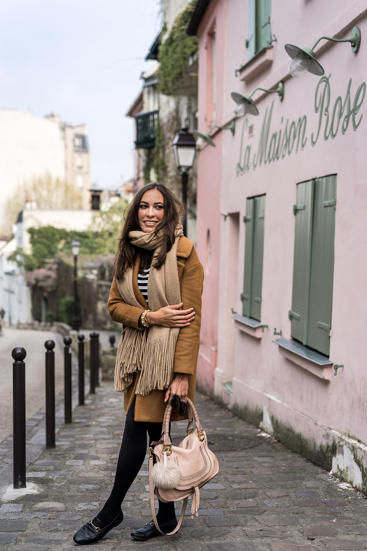 Things to do in Montmartre include dining at La Maison Rose cafe highlighted by AGlamLifestyle blogger Amanda in her tips for planning a Paris vacation