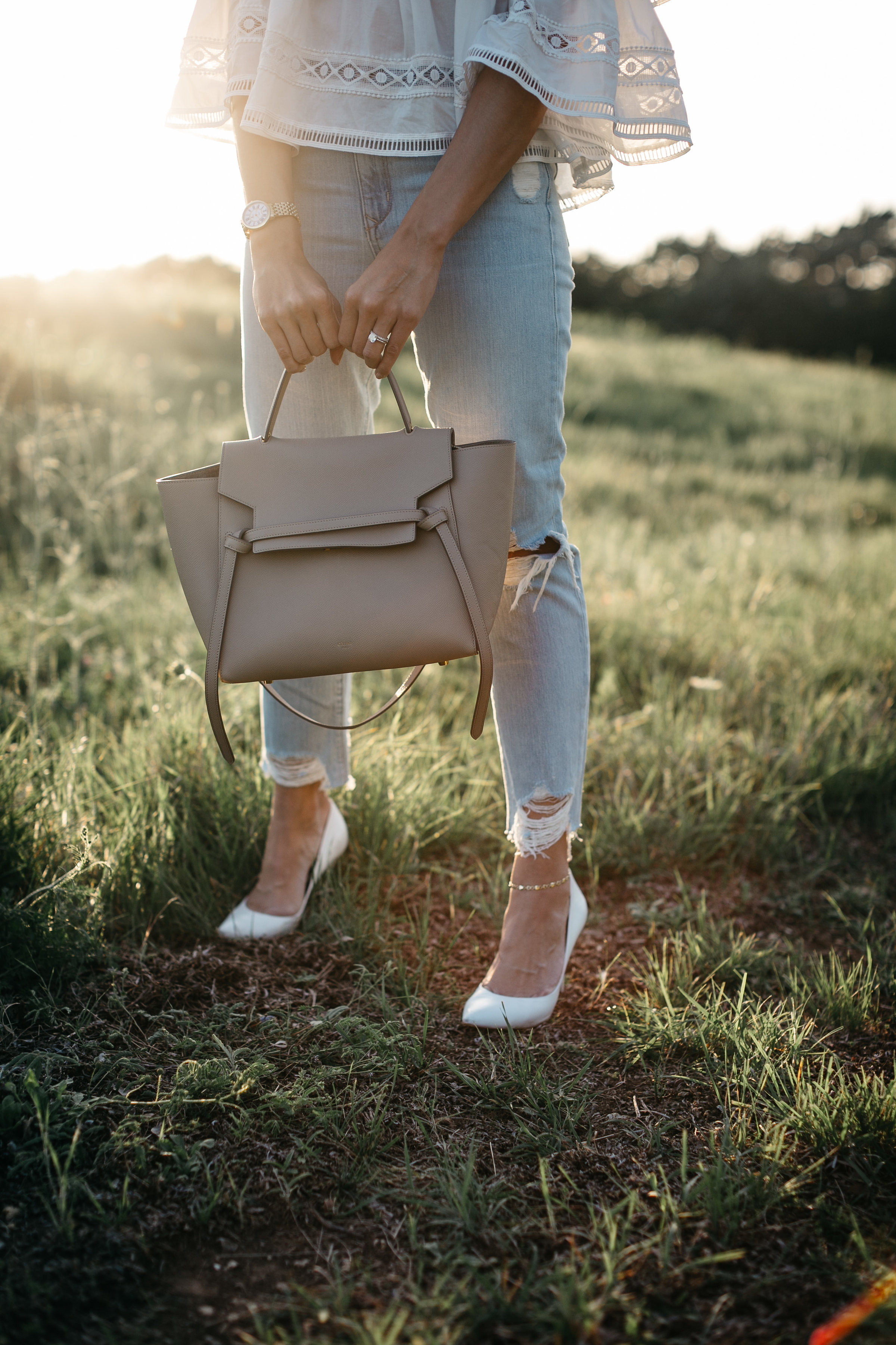 Celine belt bag worn with Lovers and Friends distressed jeans by Amanda of A Glam Lifestyle blog