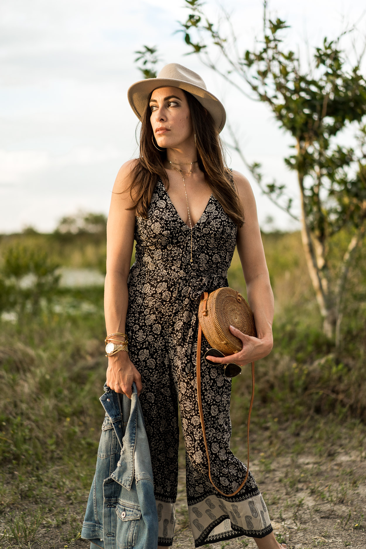 Summer boho style modeled by Amanda of A Glam Lifestyle blog in an Amuse Society jumpsuit and round basket bag