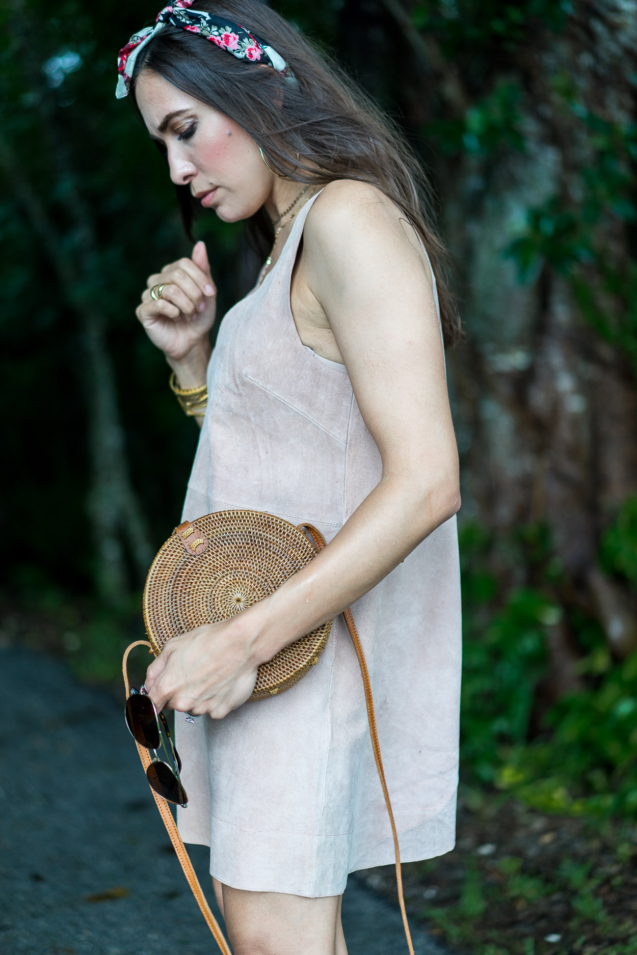 Blogger Amanda wears Free People suede dress to show her Summer style with key accessories like a round basket bag, gold avaiators and floral bandana