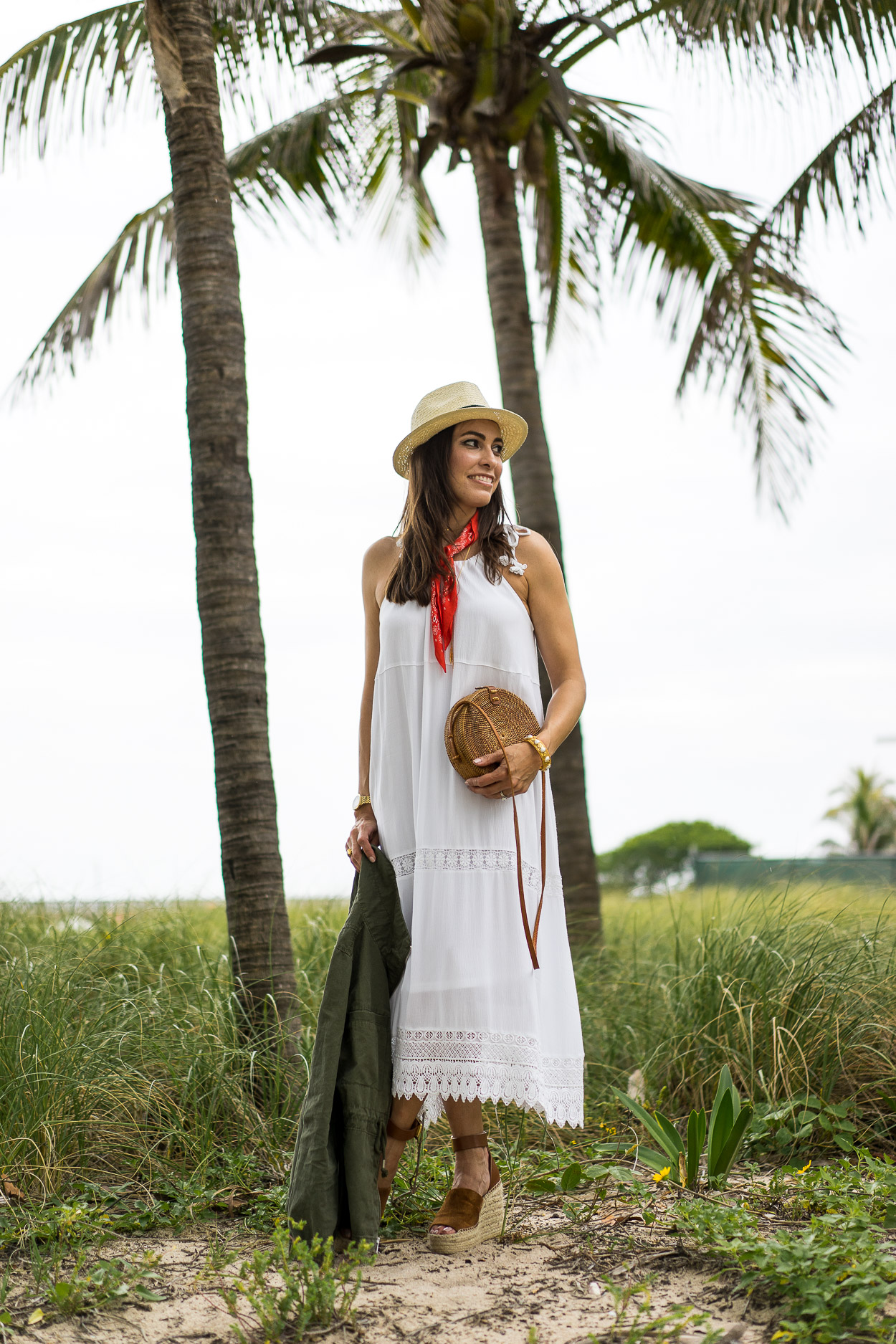 South Florida blogger Amanda shares her Old Navy summer fashion in a white crochet dress with round basket bag and green utility jacket