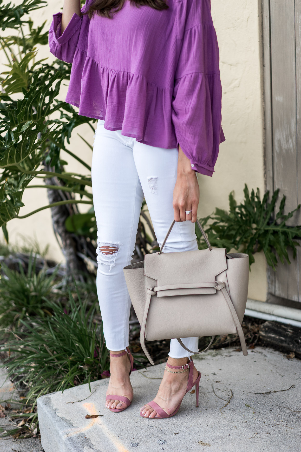 Perfect addition to a Summer must have boho top by Free People? White distressed denim and Celine belt bag styled by AGlamlifestyle blogger Amanda.