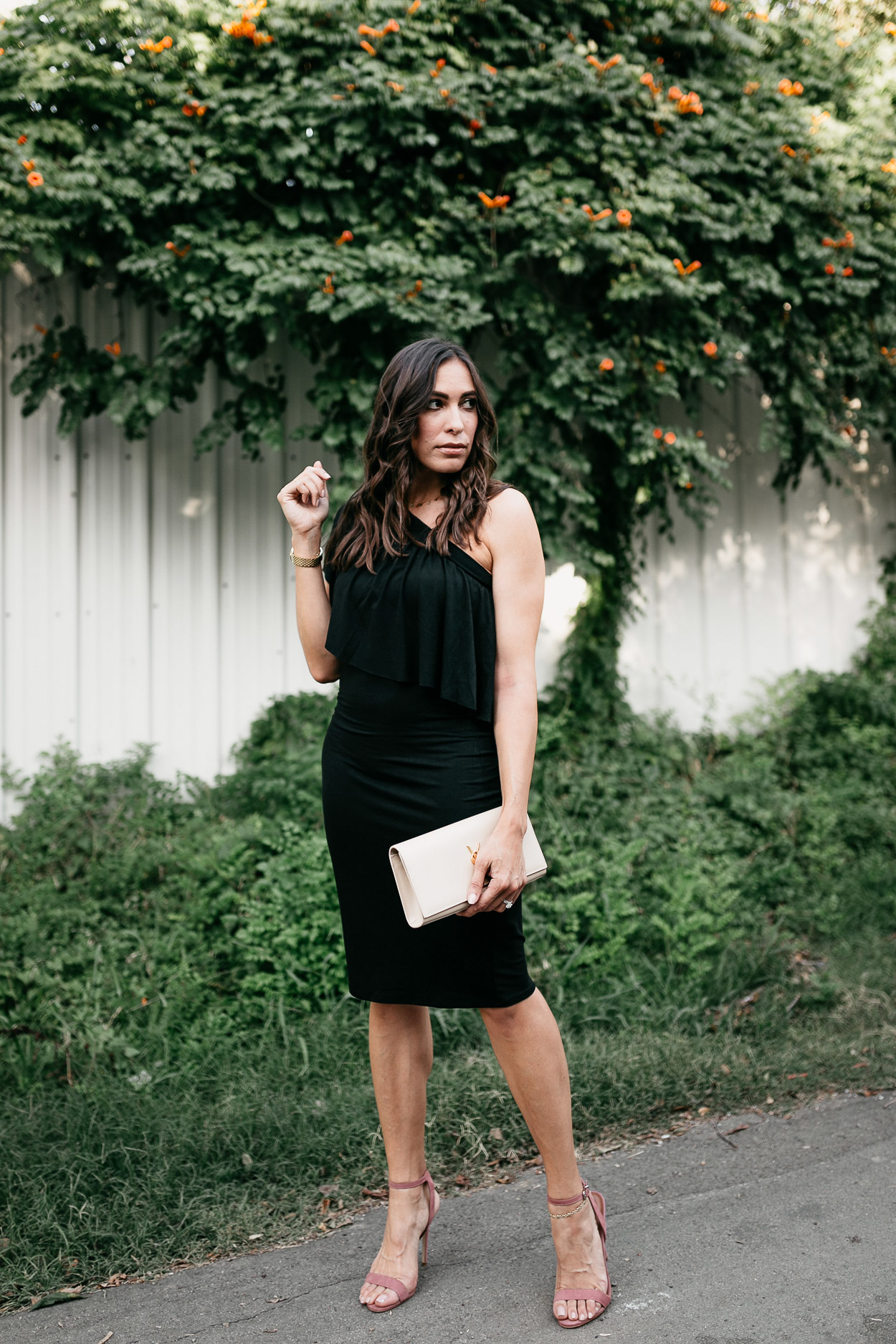 Wear a black ruffle dress like this one by Three Dots for easy date night style as shown by South Floida fashion blogger Amanda of A Glam Lifestyle, paired with Steve Madden mauve sandals and YSL monogram clutch