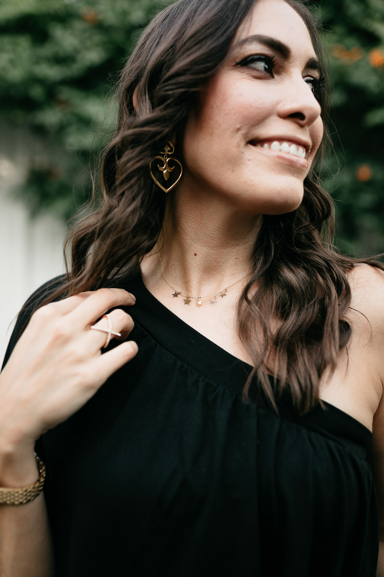 Style your black one shoulder dress with dainty gold jerelry like these Parapala Jewelry necklaces and Julie Vos earrings shown by AGlamLifestyle blogger