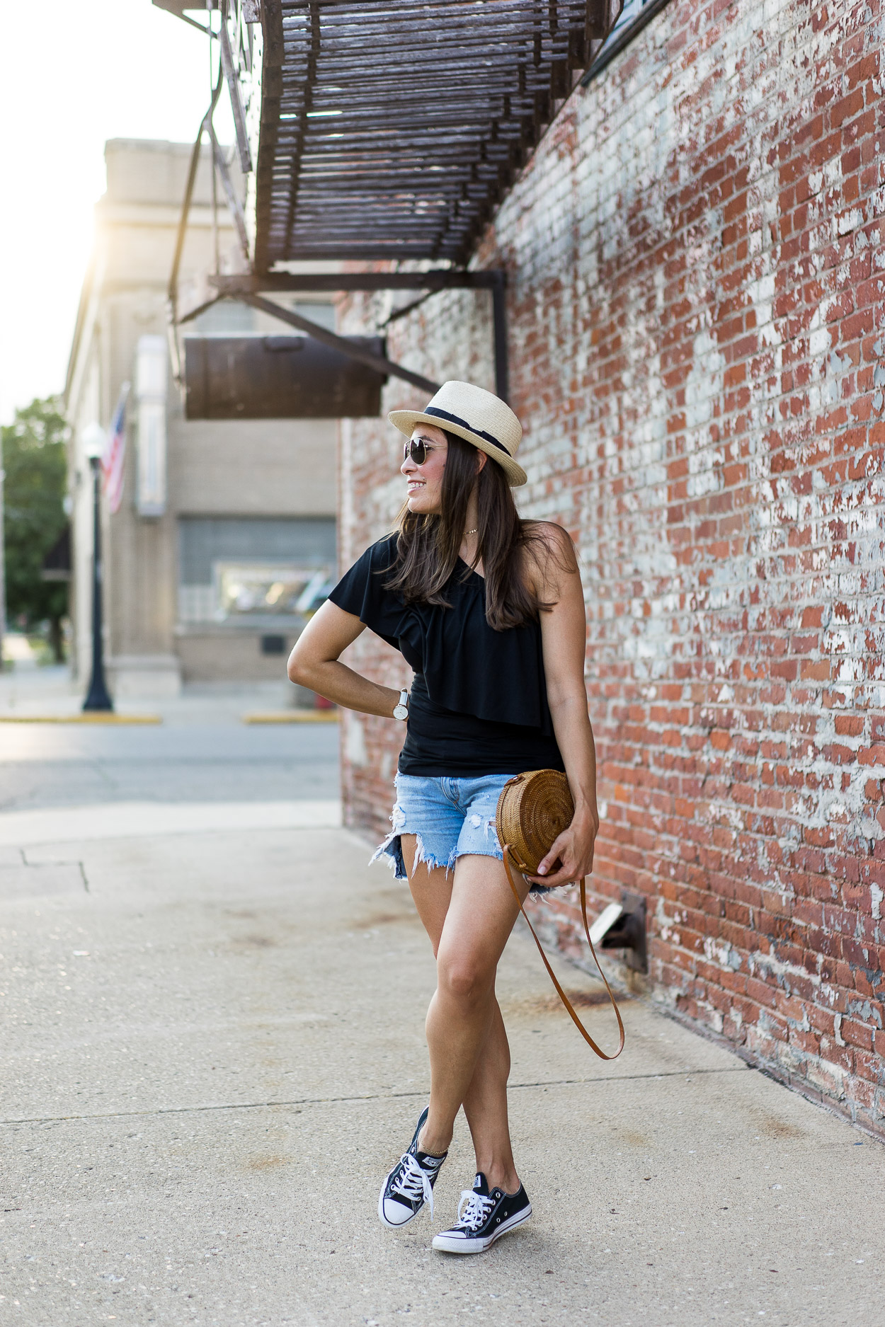 Blogger A Glam Lifestyle wears Three Dots one shoulder top for easy Summer style with Rag and Bone shorts and Old Navy Utility jacket and fedora