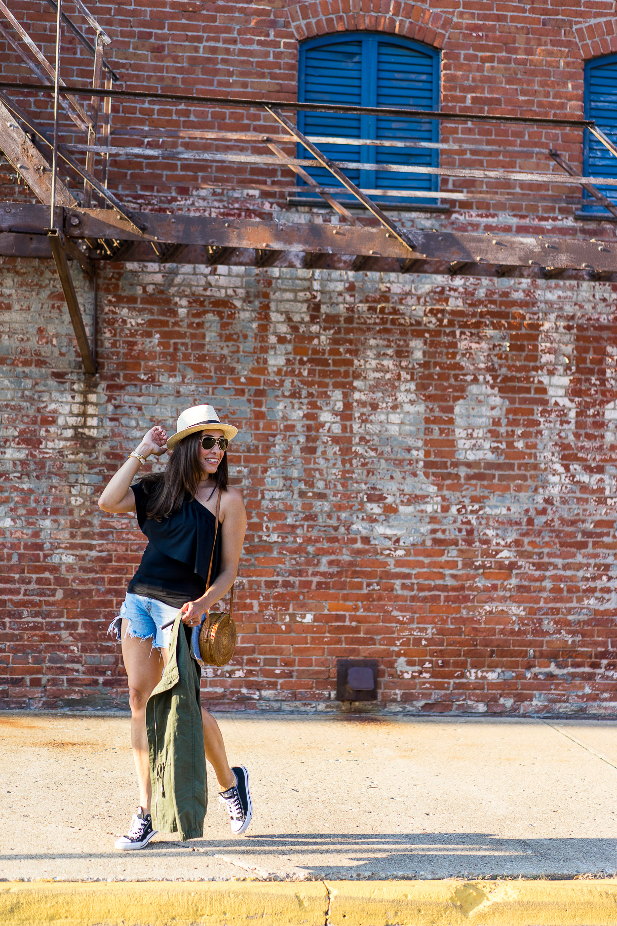 Three Dots tops are perfect for easy Summer style as worn by Amanda of A Glam Lifestyle fashion blog with Rag & Bone cutoff shorts and Old Navy utility jacket with round rattan bag from Etsy