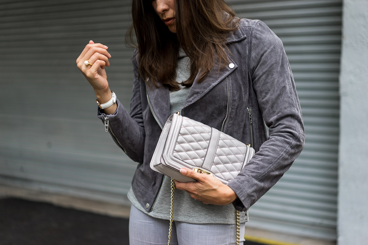 The Blank NYC grey suede jacket is a staple piece for a Fall wardrobe shown by A Glam Lifestyle blogger Amanda with her Rebecca Minkoff Love Crossbody bag as her token accessory