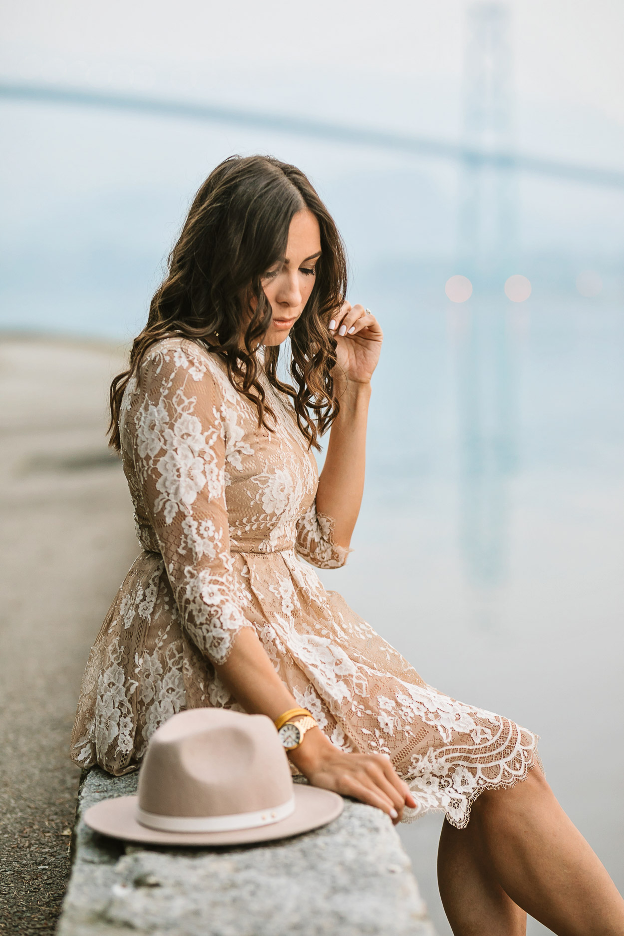 Blogger Amanda of A Glam Lifestyle wears Chicwish lace dress at Lions Gate bridge in Vancouver